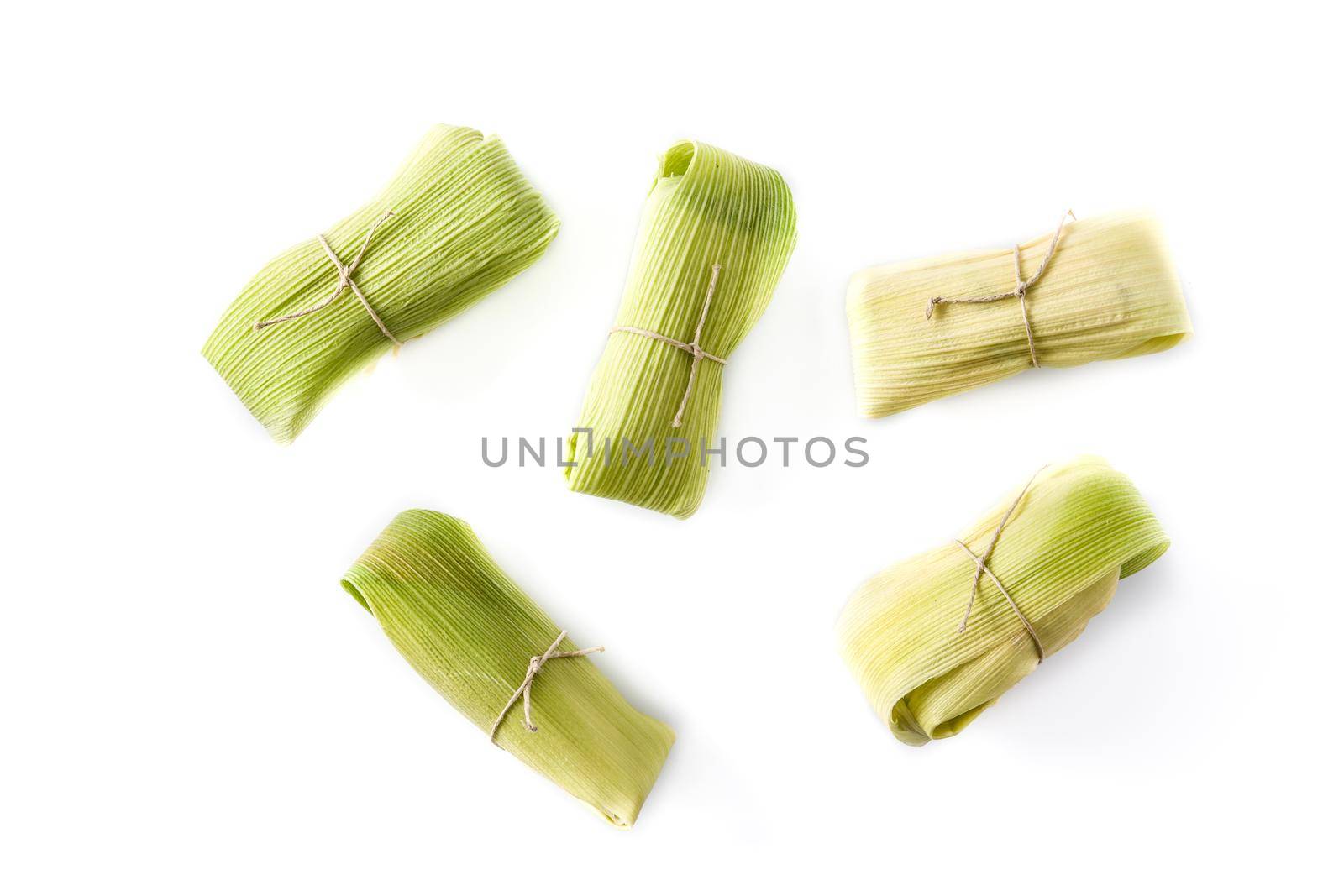 Mexican corn and chicken tamales isolated on white background.