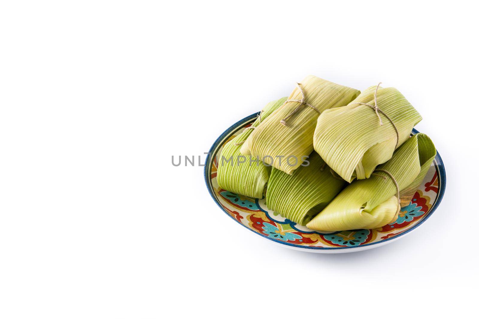 Mexican corn and chicken tamales isolated on white background