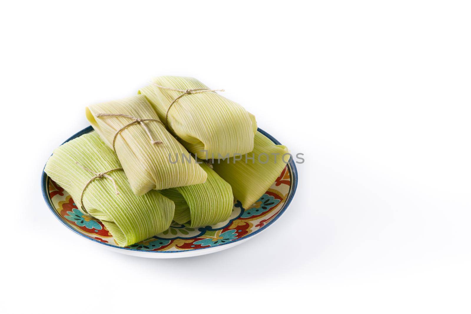 Mexican corn and chicken tamales isolated on white background