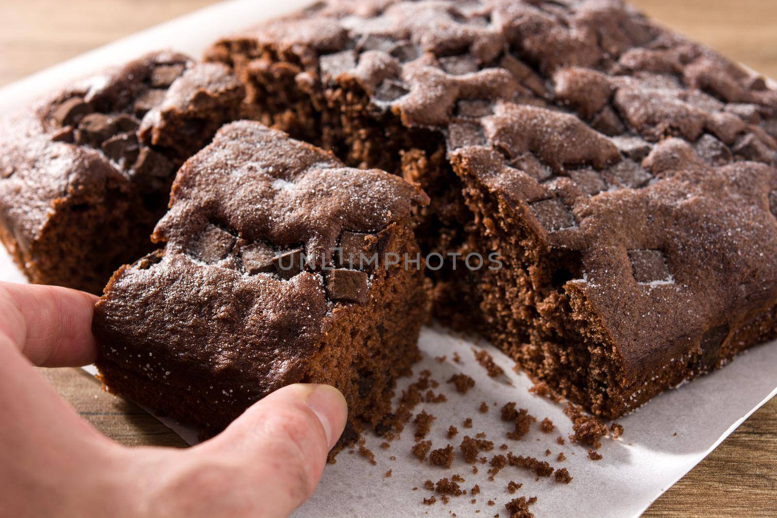 Picking up a delicious chocolate cake portion