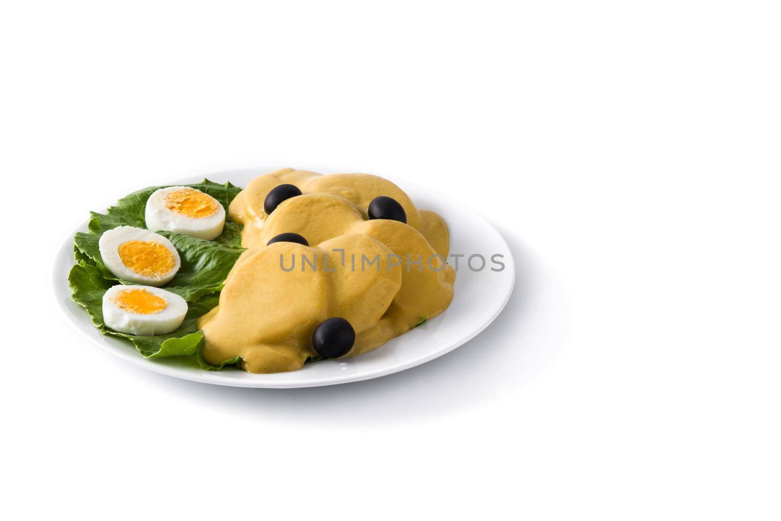 Traditional Peruvian papa a la huancaina isolated on white background