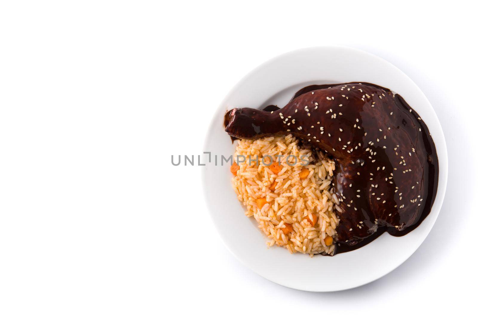 Traditional mole Poblano with rice in plate by chandlervid85