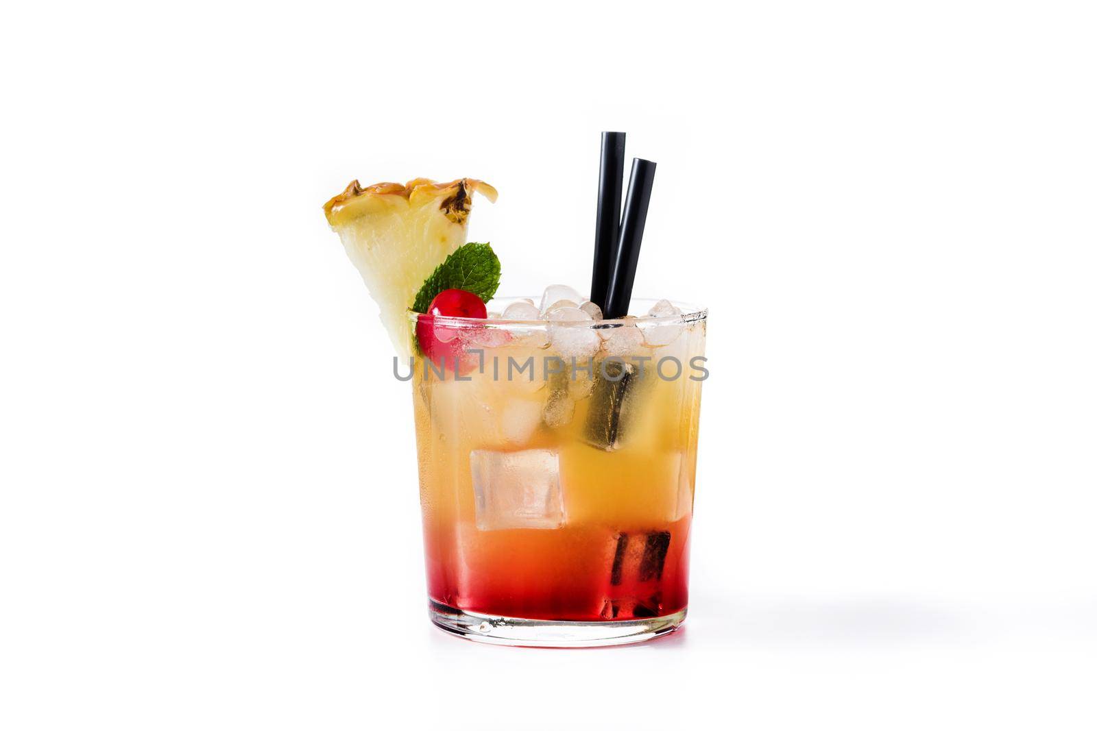 Cold mai tai cocktail with pineapple and cherry isolated on white background