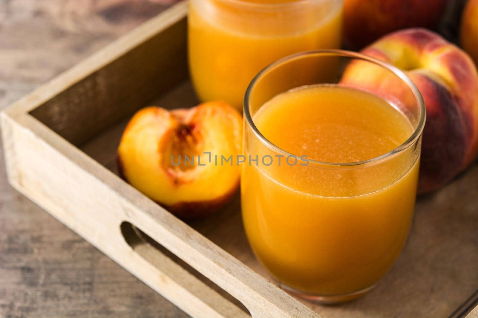 Natural peach juice in glass by chandlervid85