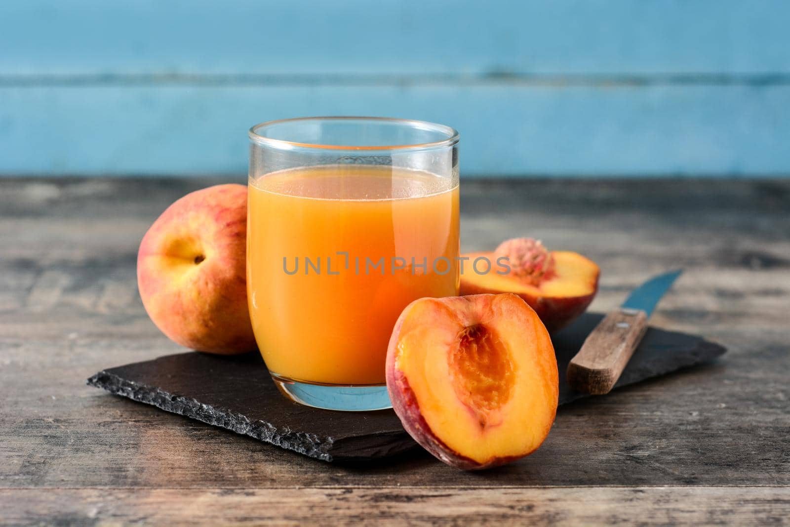 Natural peach juice in glass by chandlervid85