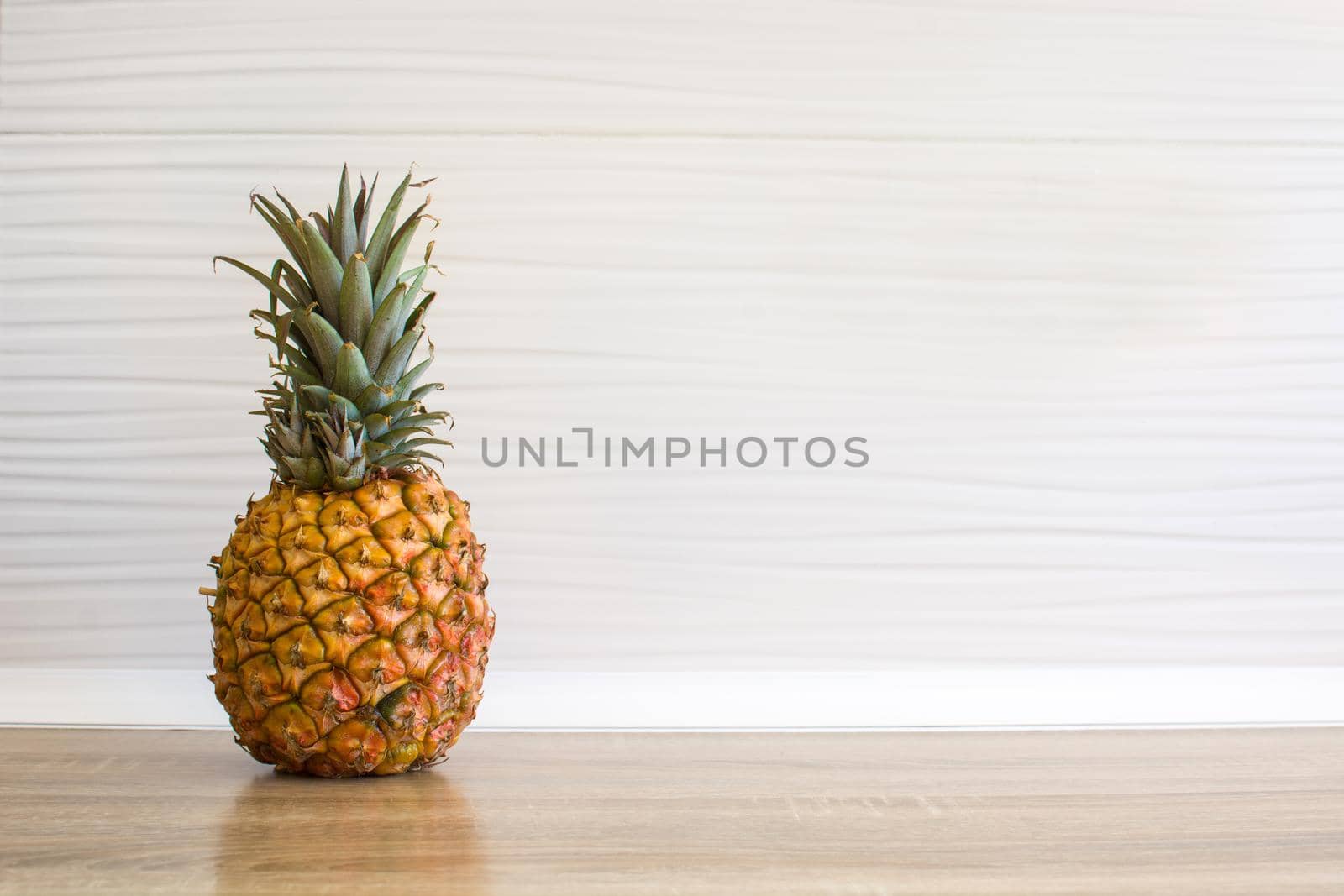 Pineapple im the kitchen with copyspace