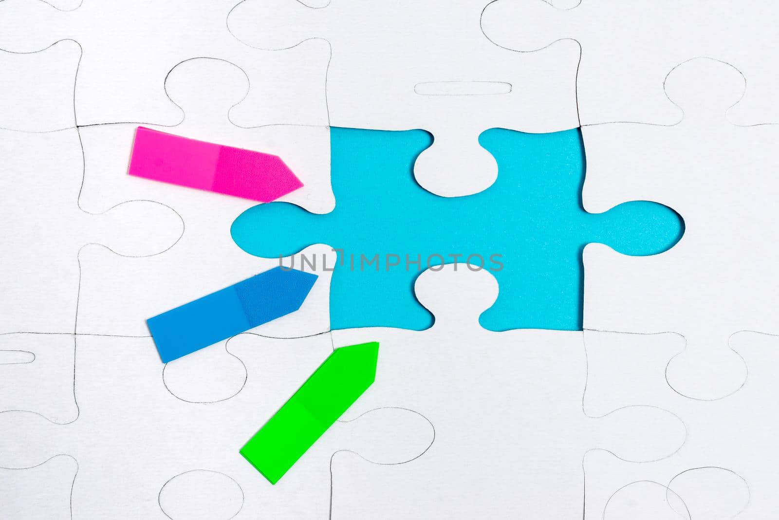 Building An Unfinished White Jigsaw Pattern Puzzle With Missing Last Piece