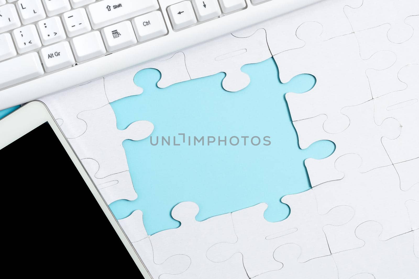 Building An Unfinished White Jigsaw Pattern Puzzle With Missing Last Piece