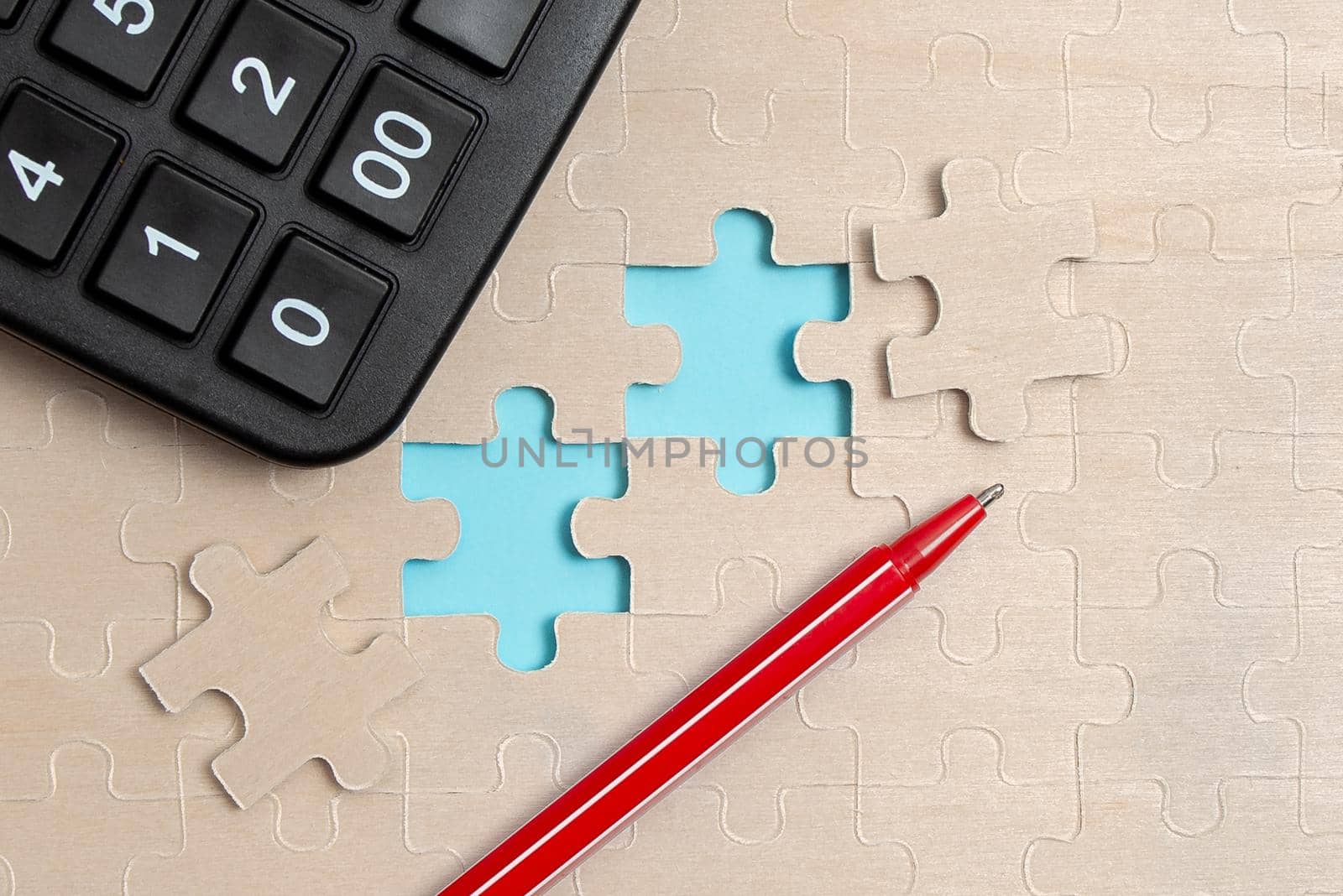 Building An Unfinished White Jigsaw Pattern Puzzle With Missing Last Piece
