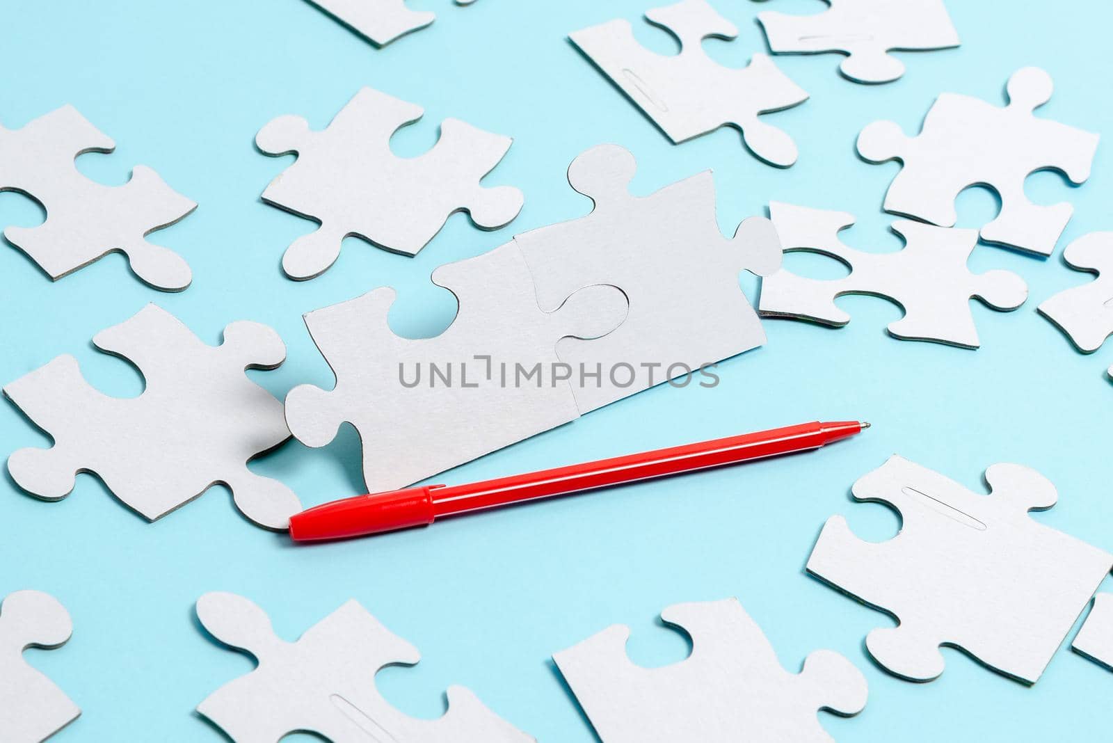 Building An Unfinished White Jigsaw Pattern Puzzle With Missing Last Piece