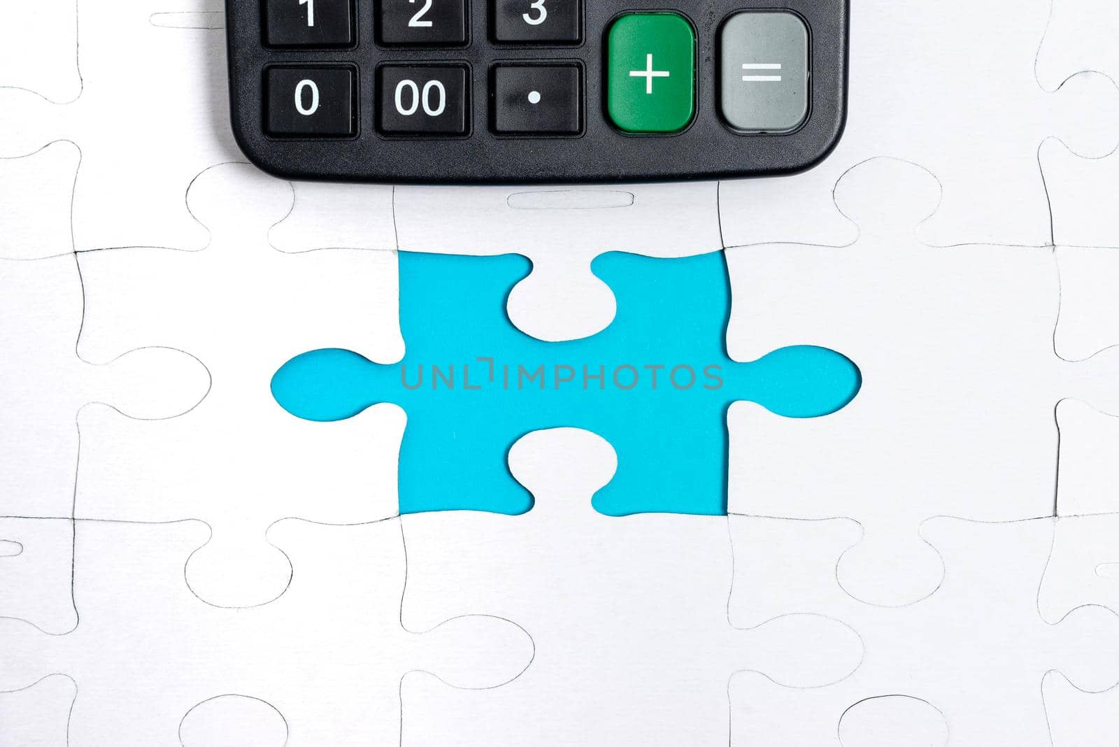 Building An Unfinished White Jigsaw Pattern Puzzle With Missing Last Piece