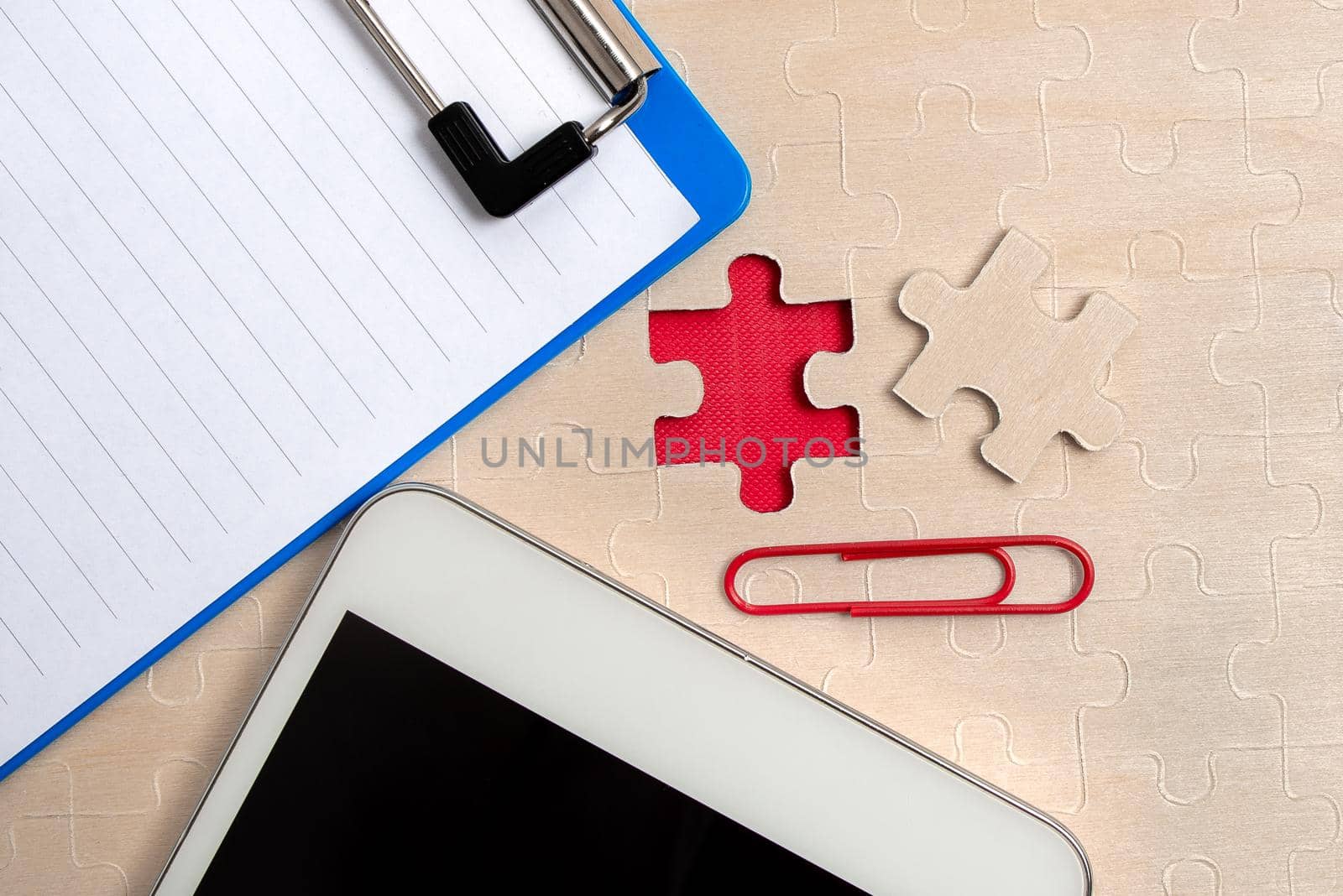 Building An Unfinished White Jigsaw Pattern Puzzle With Missing Last Piece