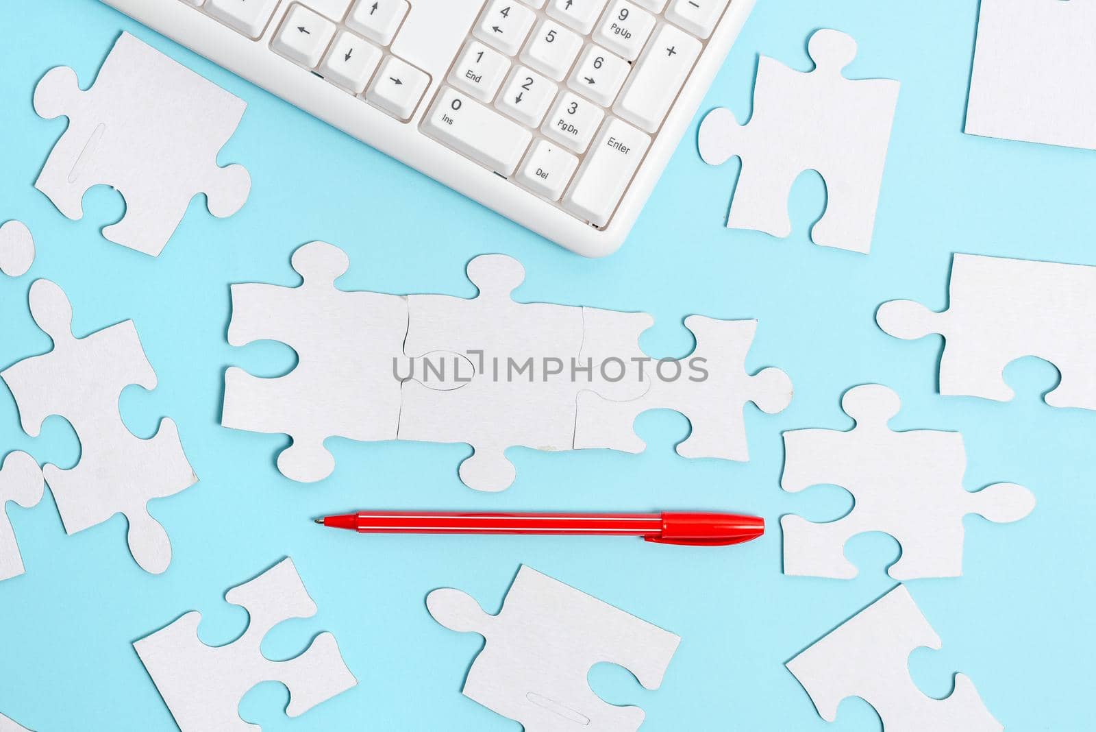 Building An Unfinished White Jigsaw Pattern Puzzle With Missing Last Piece