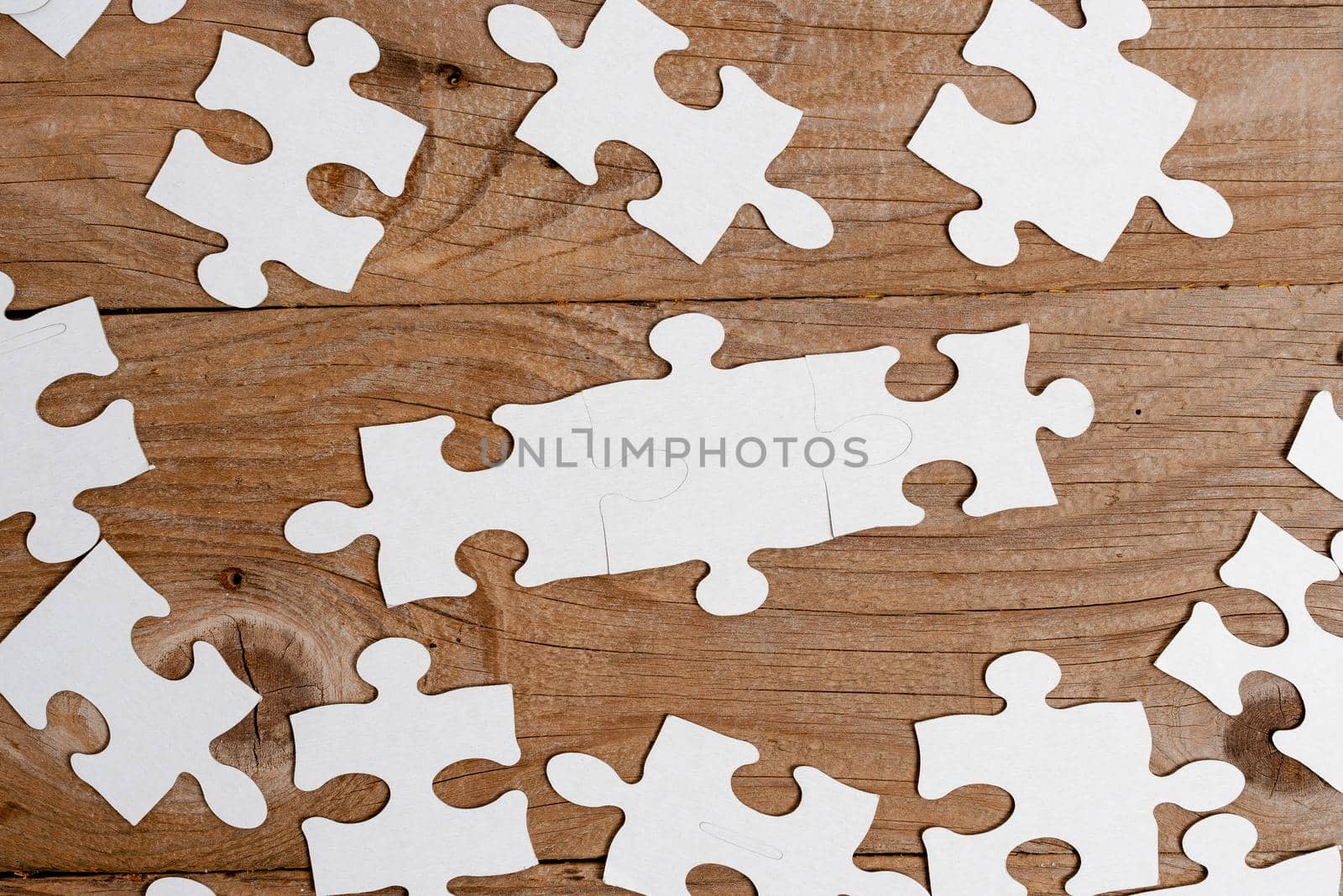 Building An Unfinished White Jigsaw Pattern Puzzle With Missing Last Piece