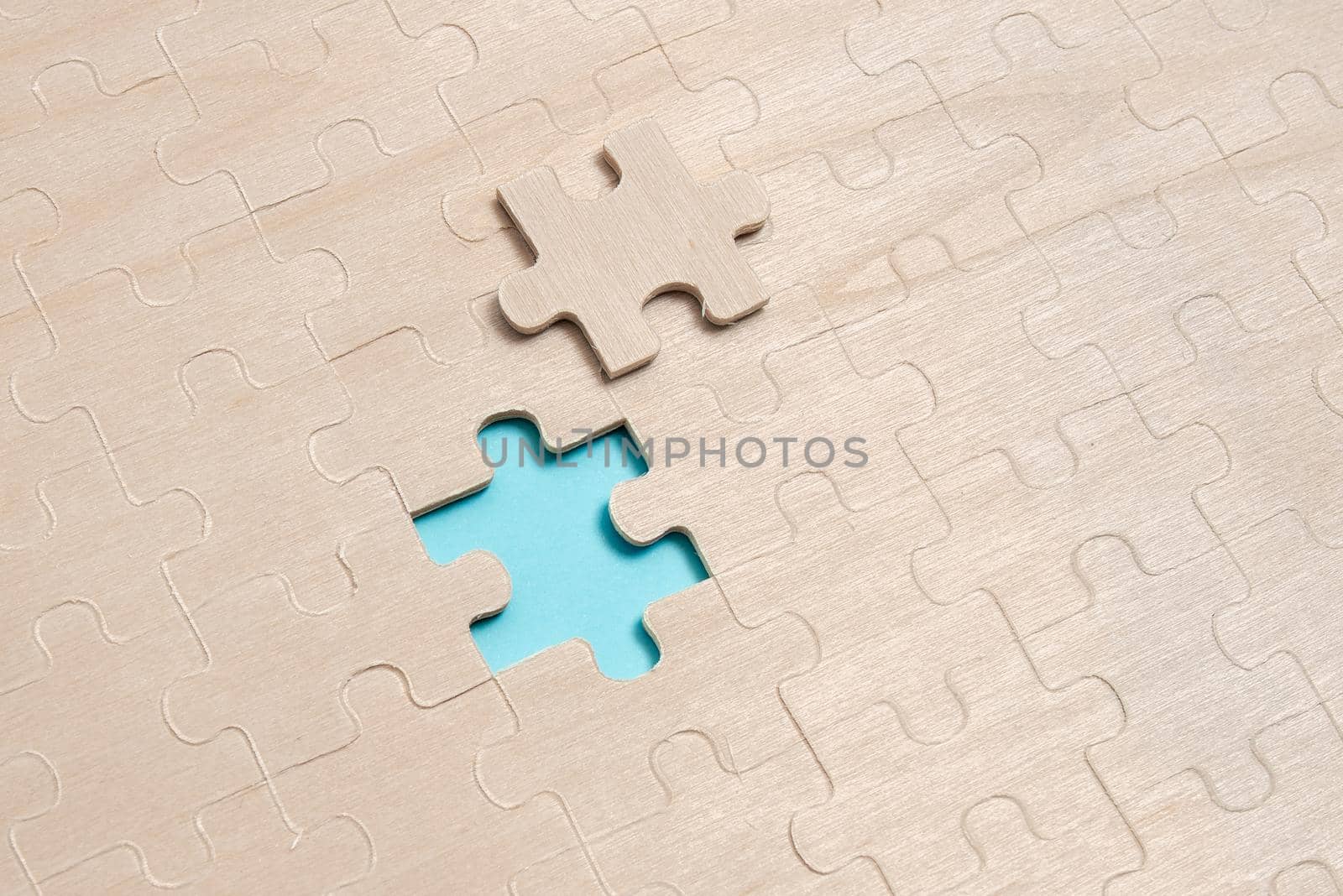 Building An Unfinished White Jigsaw Pattern Puzzle With Missing Last Piece