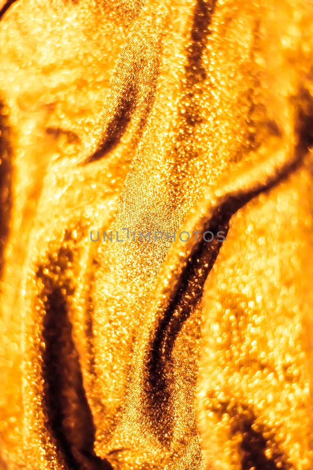 Luxe glowing texture, night club branding and New Years party concept - Golden holiday sparkling glitter abstract background, luxury shiny fabric material for glamour design and festive invitation