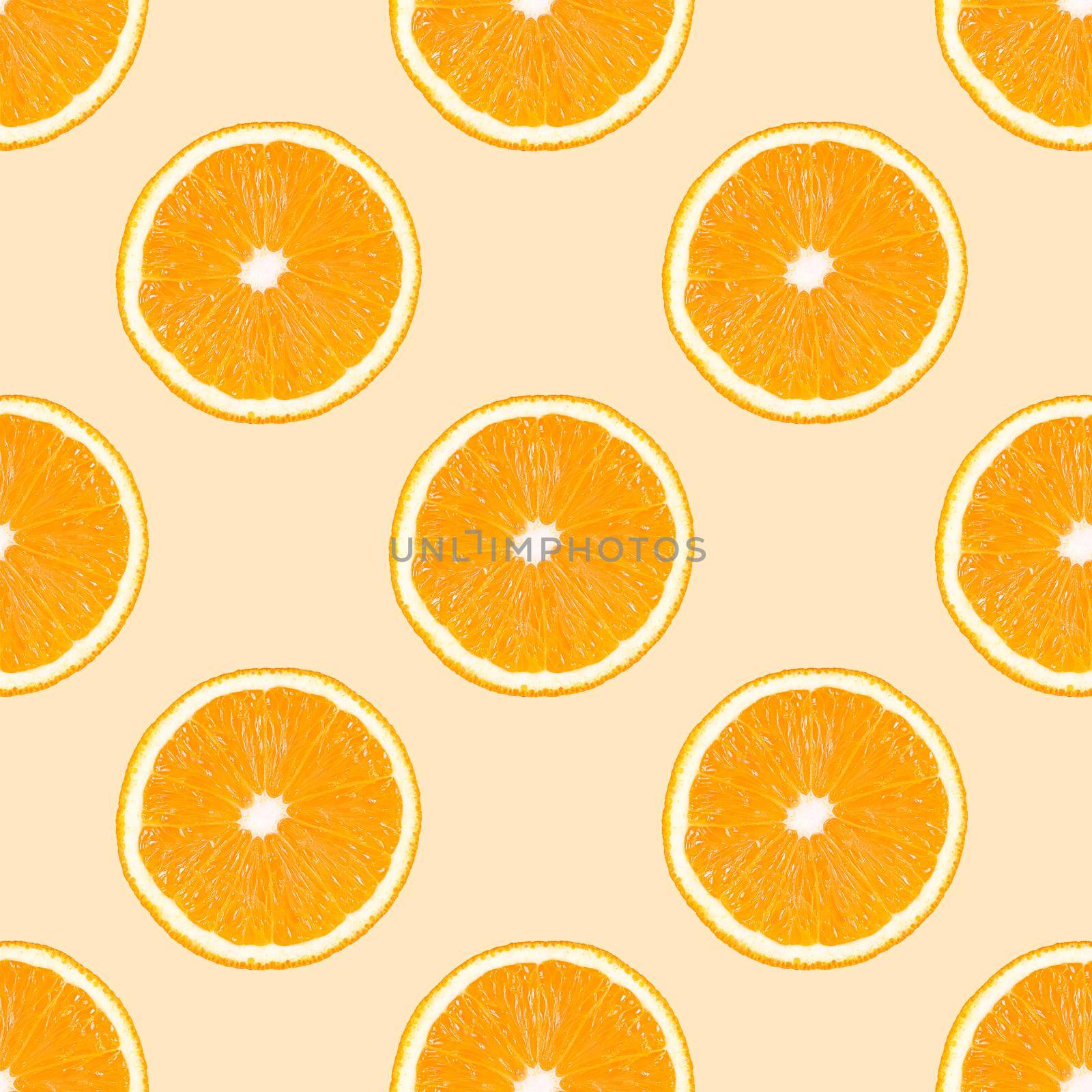 Seamless pattern made from orange fruit slices on a beige background.