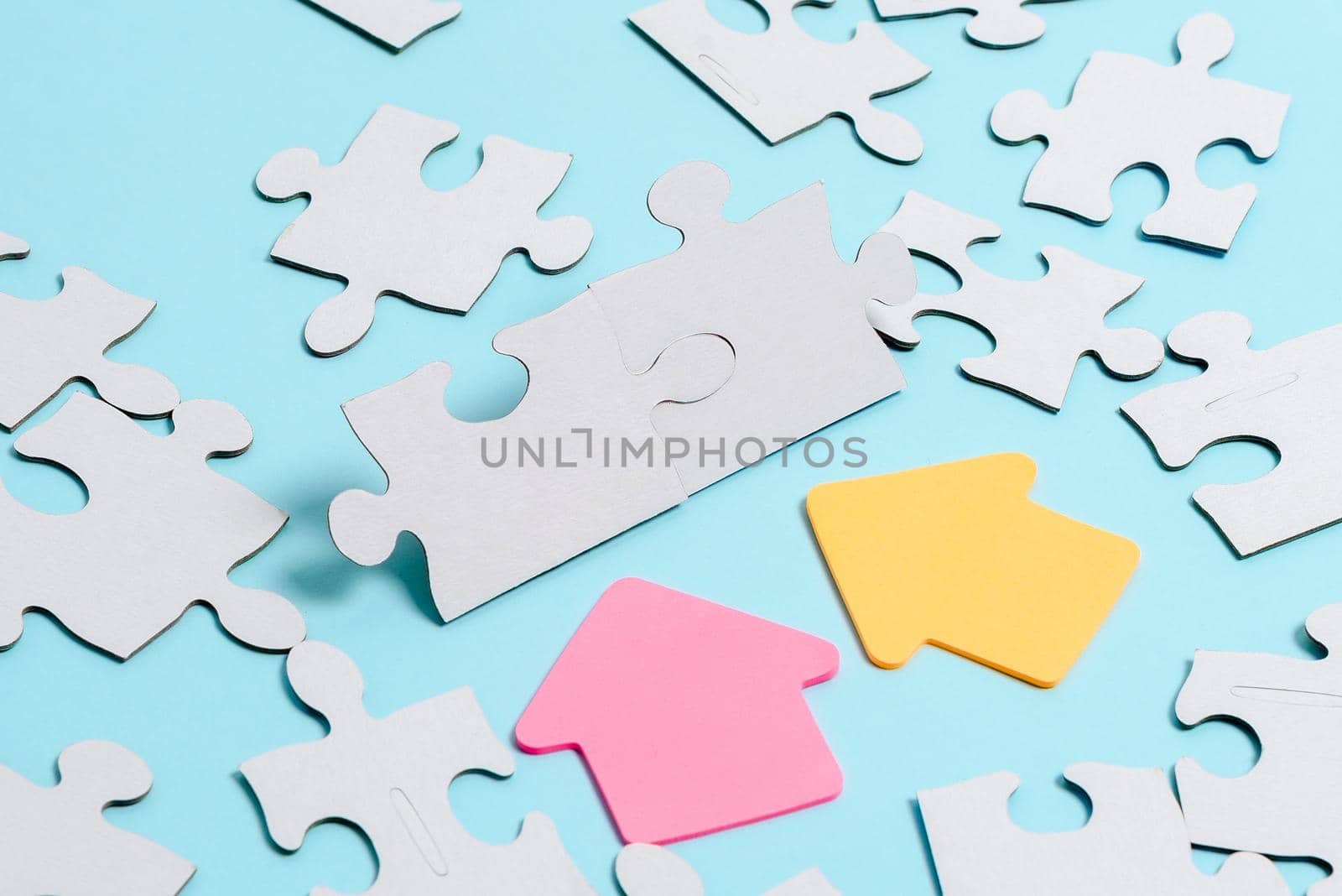 Building An Unfinished White Jigsaw Pattern Puzzle With Missing Last Piece