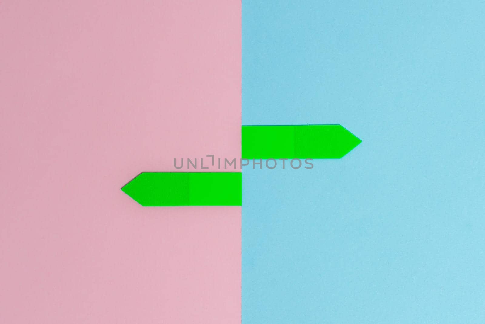 Two Objects Arranged Facing Inward Outward On a Separated Coloured Background