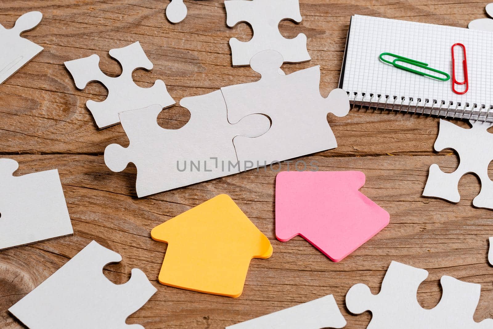 Building An Unfinished White Jigsaw Pattern Puzzle With Missing Last Piece