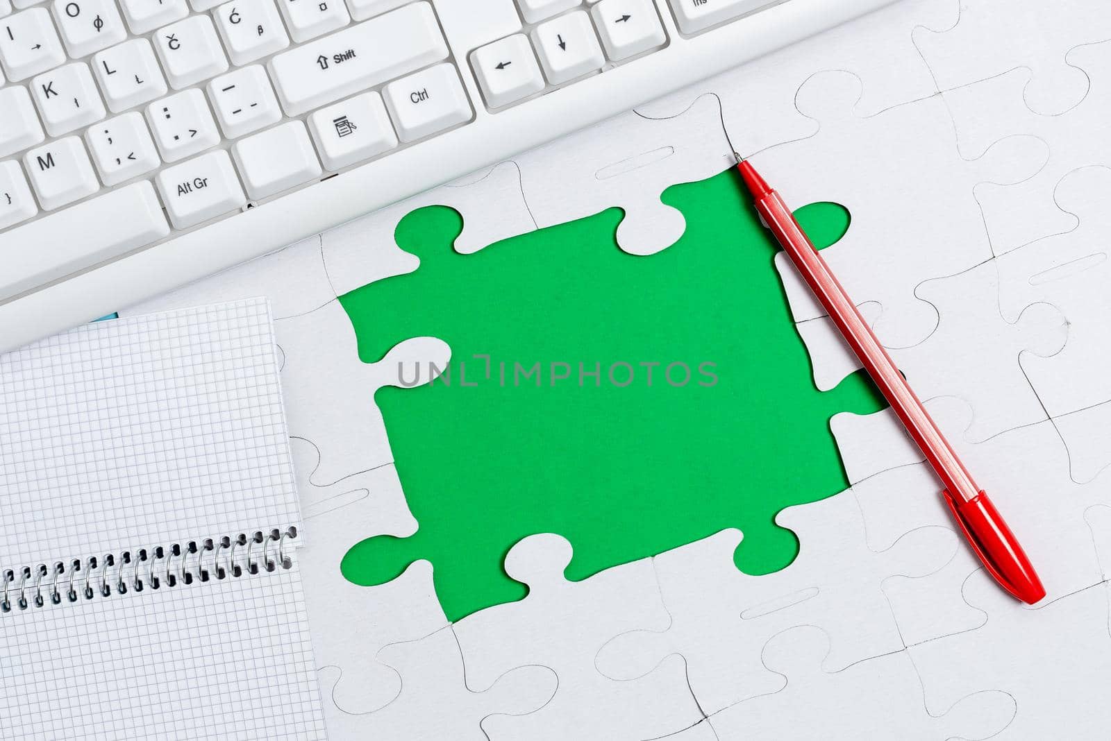 Building An Unfinished White Jigsaw Pattern Puzzle With Missing Last Piece