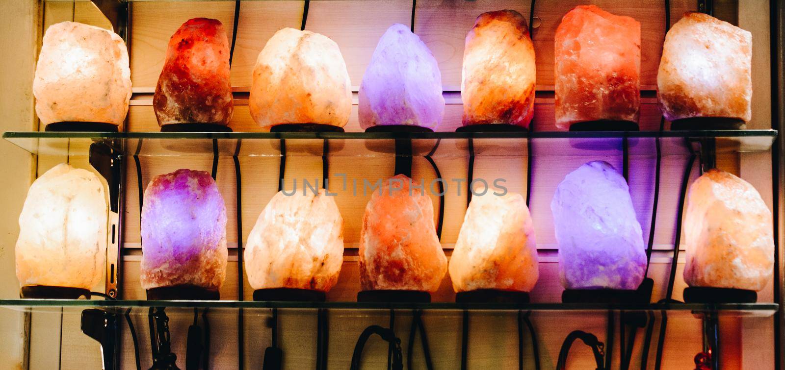 Organic Himalayan salt lamps illuminate in multi colors