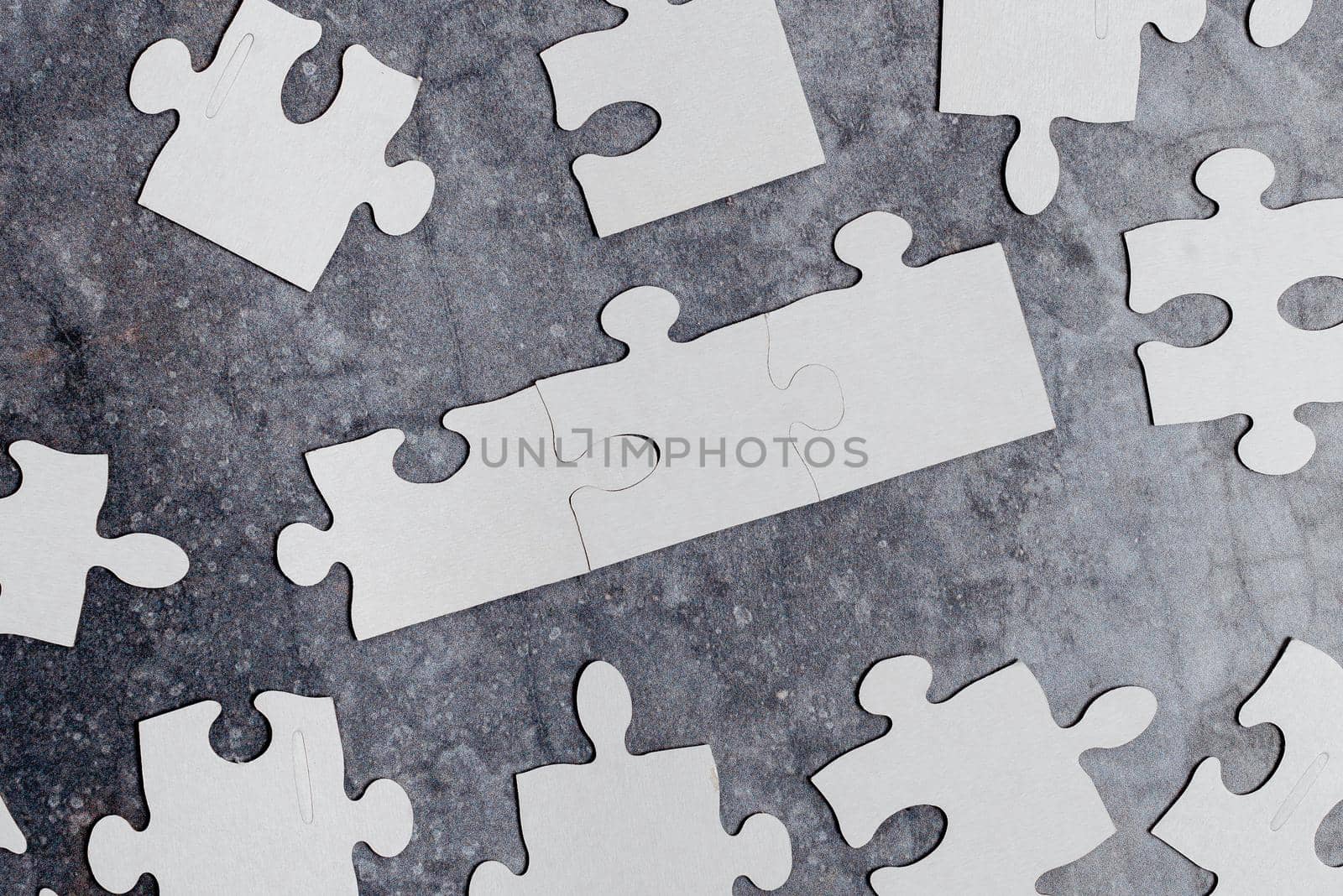 Building An Unfinished White Jigsaw Pattern Puzzle With Missing Last Piece