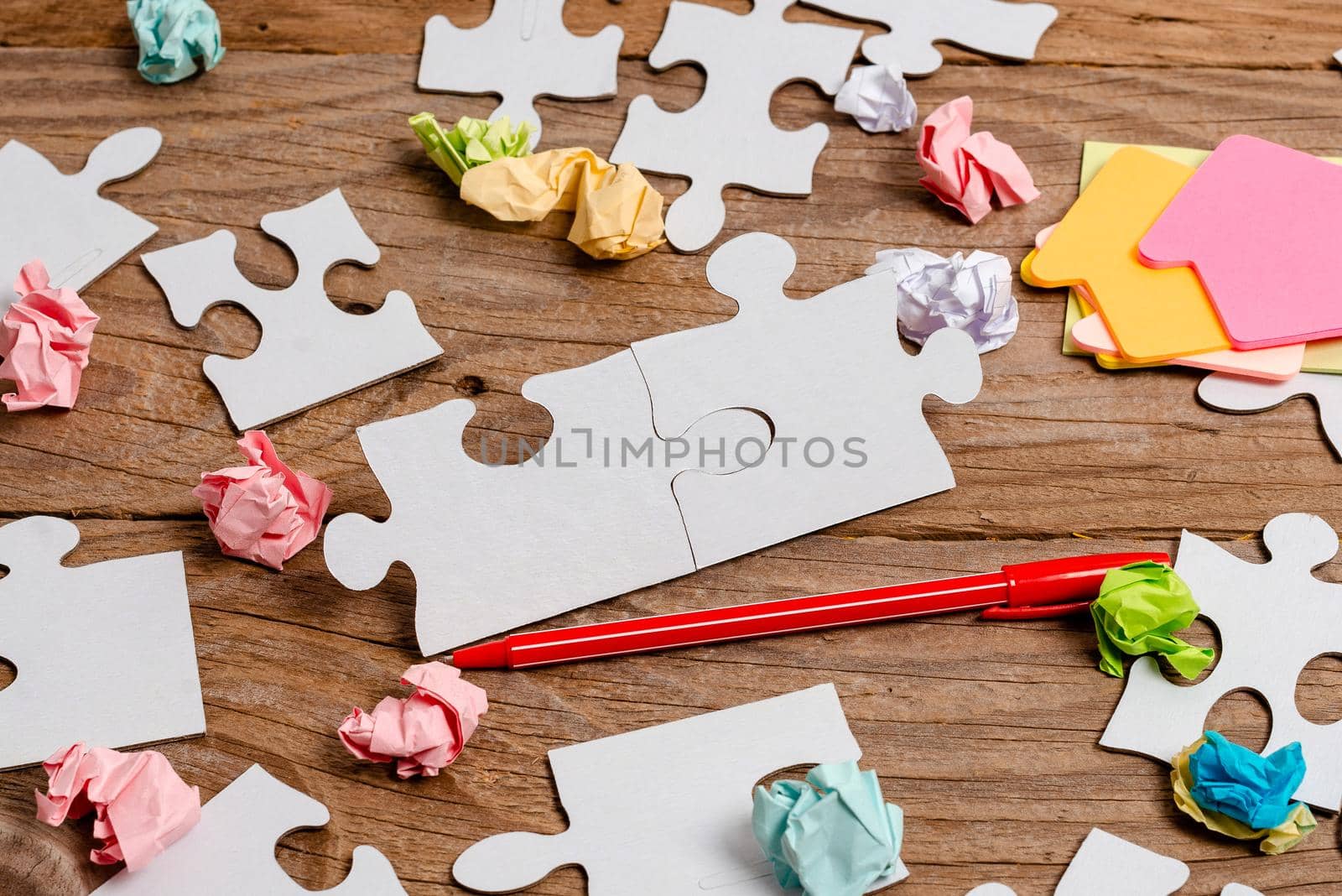 Building An Unfinished White Jigsaw Pattern Puzzle With Missing Last Piece