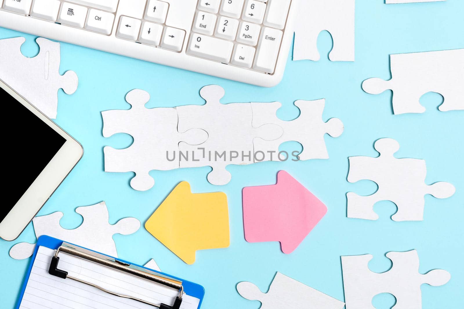 Building An Unfinished White Jigsaw Pattern Puzzle With Missing Last Piece