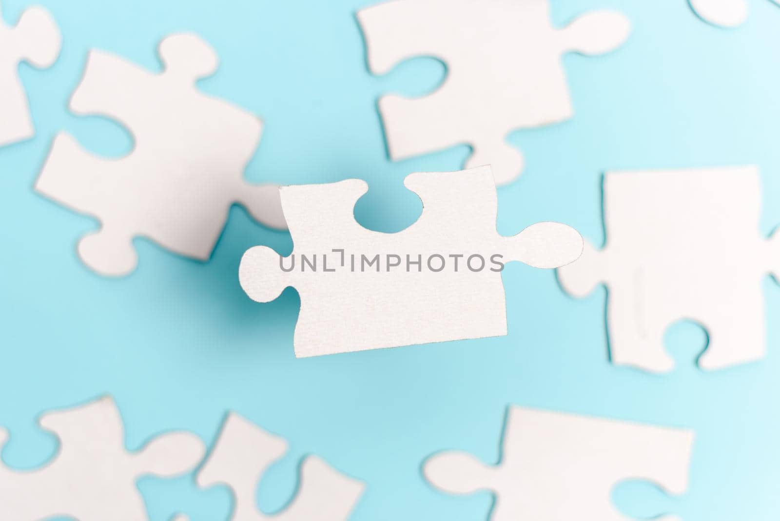 Building An Unfinished White Jigsaw Pattern Puzzle With Missing Last Piece