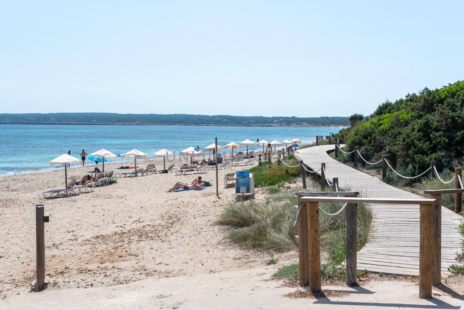 Formentera, Spain: June 12, 2021: People on Migjorn beach in Formentera in Spain in Times of COvid 19
