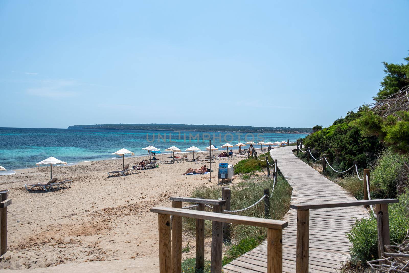 Formentera, Spain: June 12, 2021: People on Migjorn beach in Formentera in Spain in Times of COvid 19