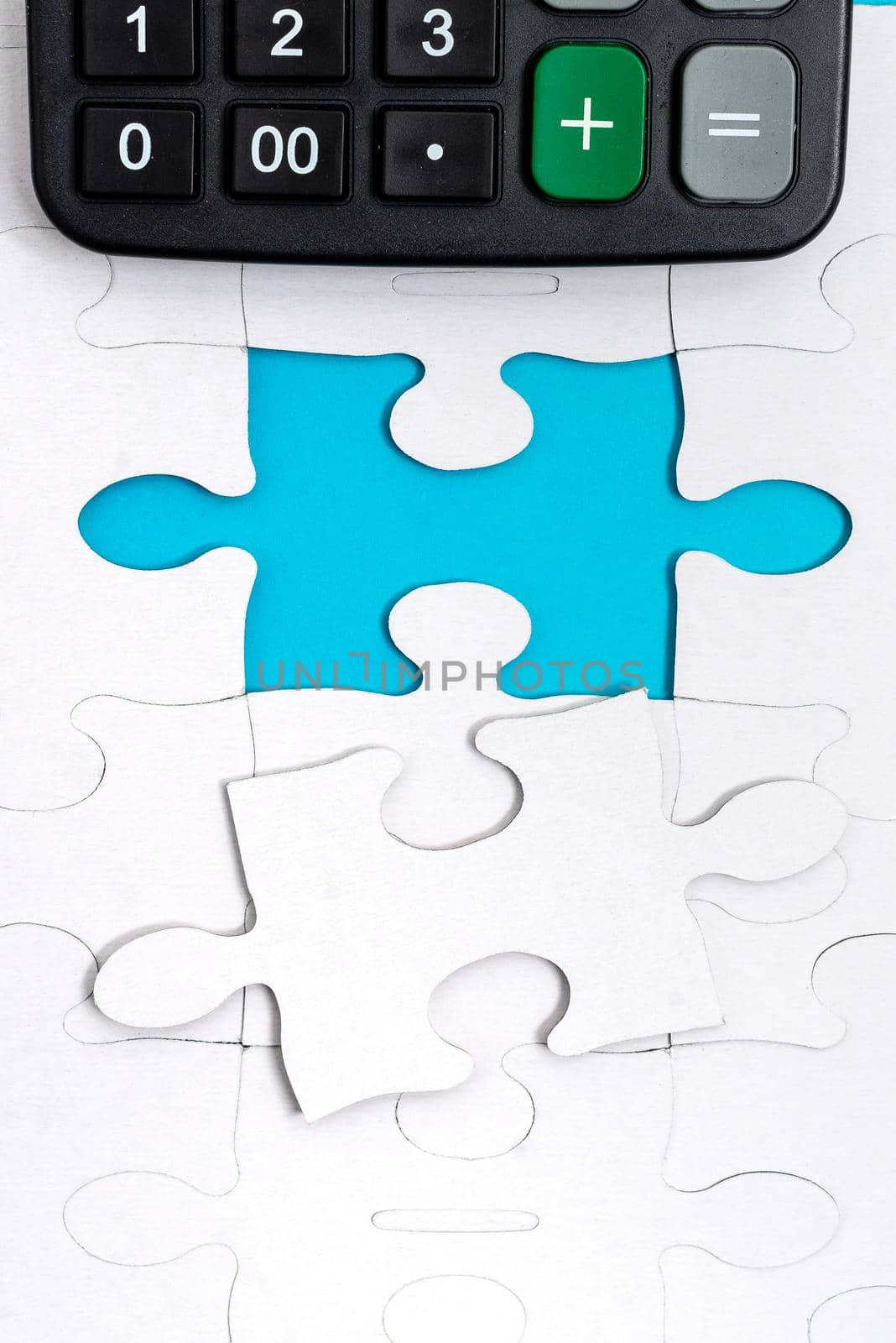 Building An Unfinished White Jigsaw Pattern Puzzle With Missing Last Piece