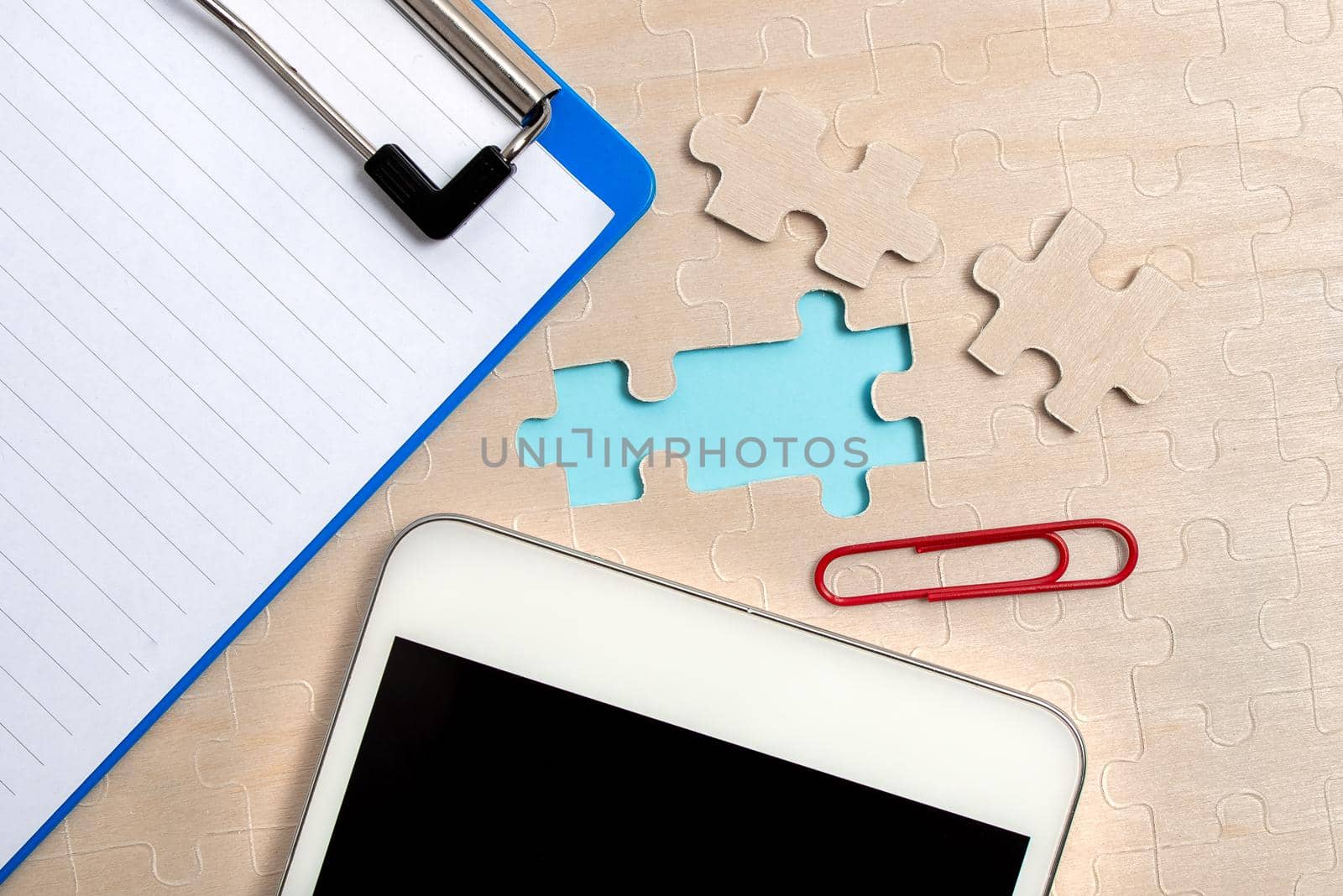 Building An Unfinished White Jigsaw Pattern Puzzle With Missing Last Piece