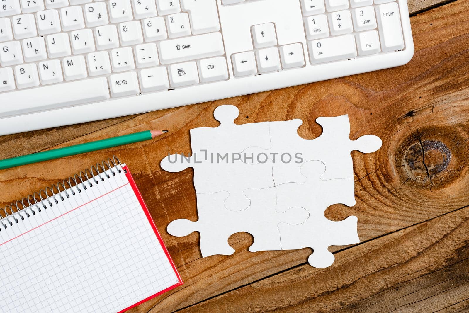 Building An Unfinished White Jigsaw Pattern Puzzle With Missing Last Piece