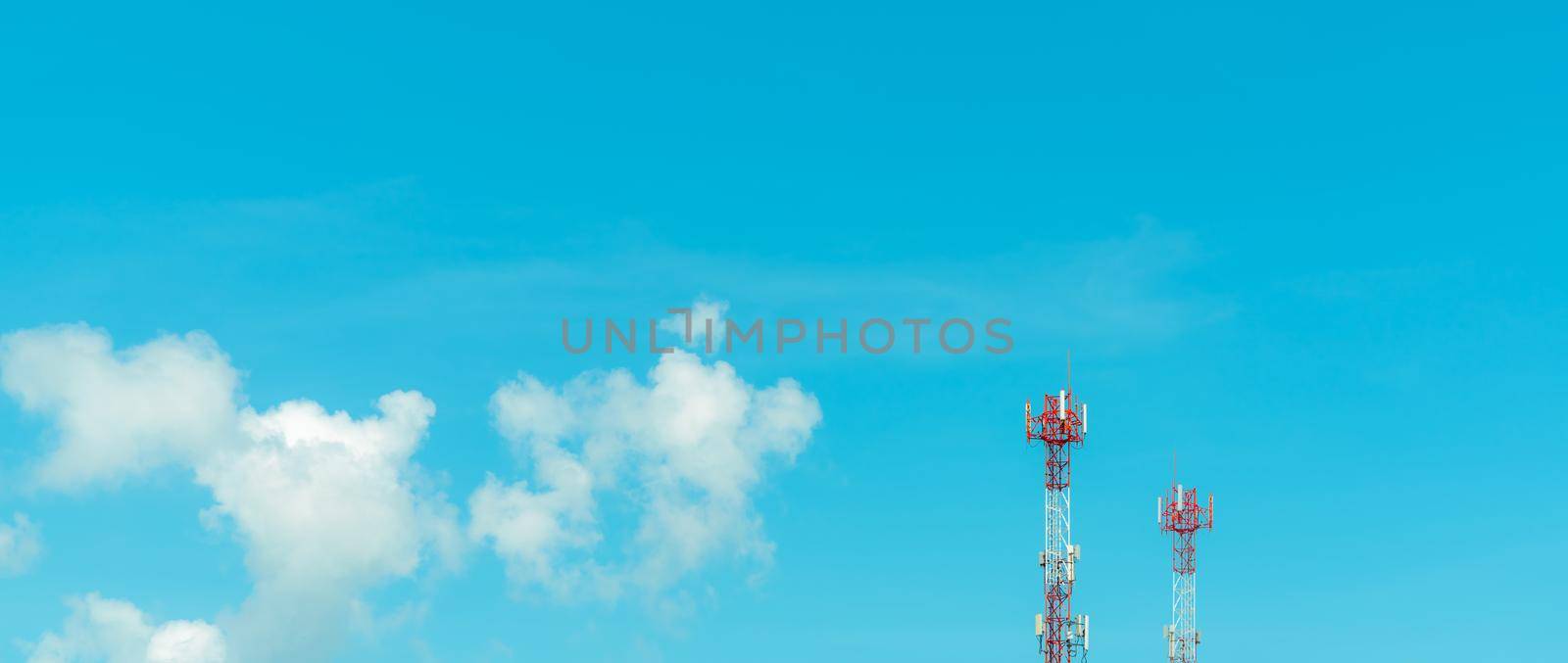 Telecommunication tower with blue sky and white clouds. Radio and satellite pole. Communication technology. Telecommunication industry. Mobile or telecom 4g and 5g network. Telecommunication pylon.