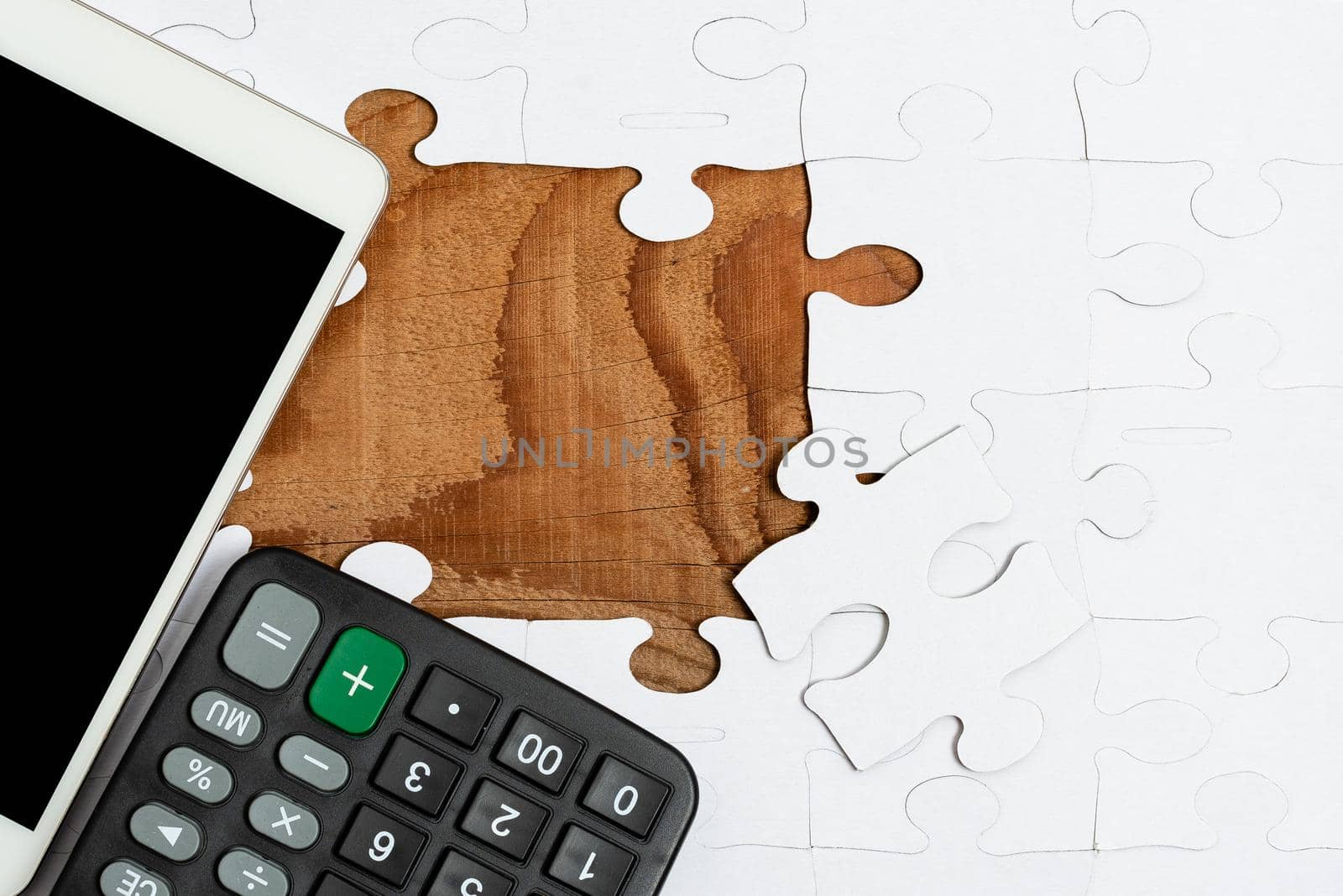 Building An Unfinished White Jigsaw Pattern Puzzle With Missing Last Piece