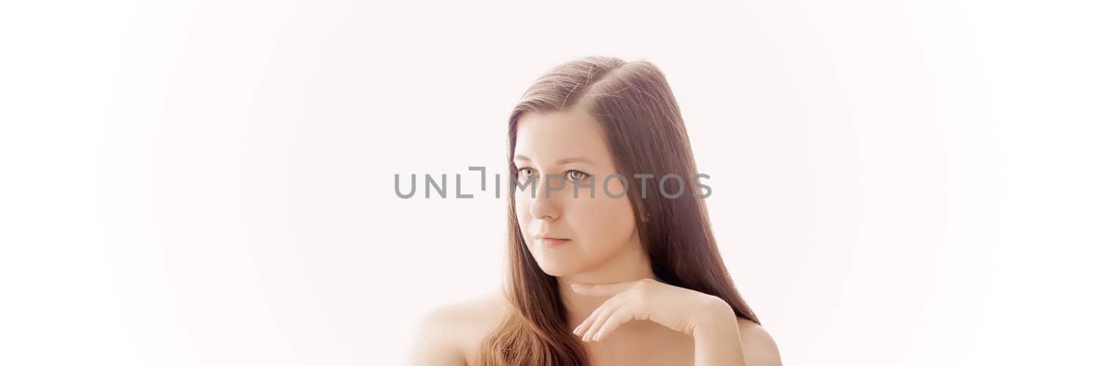 Beautiful woman with natural look, perfect skin and shiny hair as make-up, health and wellness concept. Face portrait of young female model for skincare cosmetics and luxury beauty ad design.