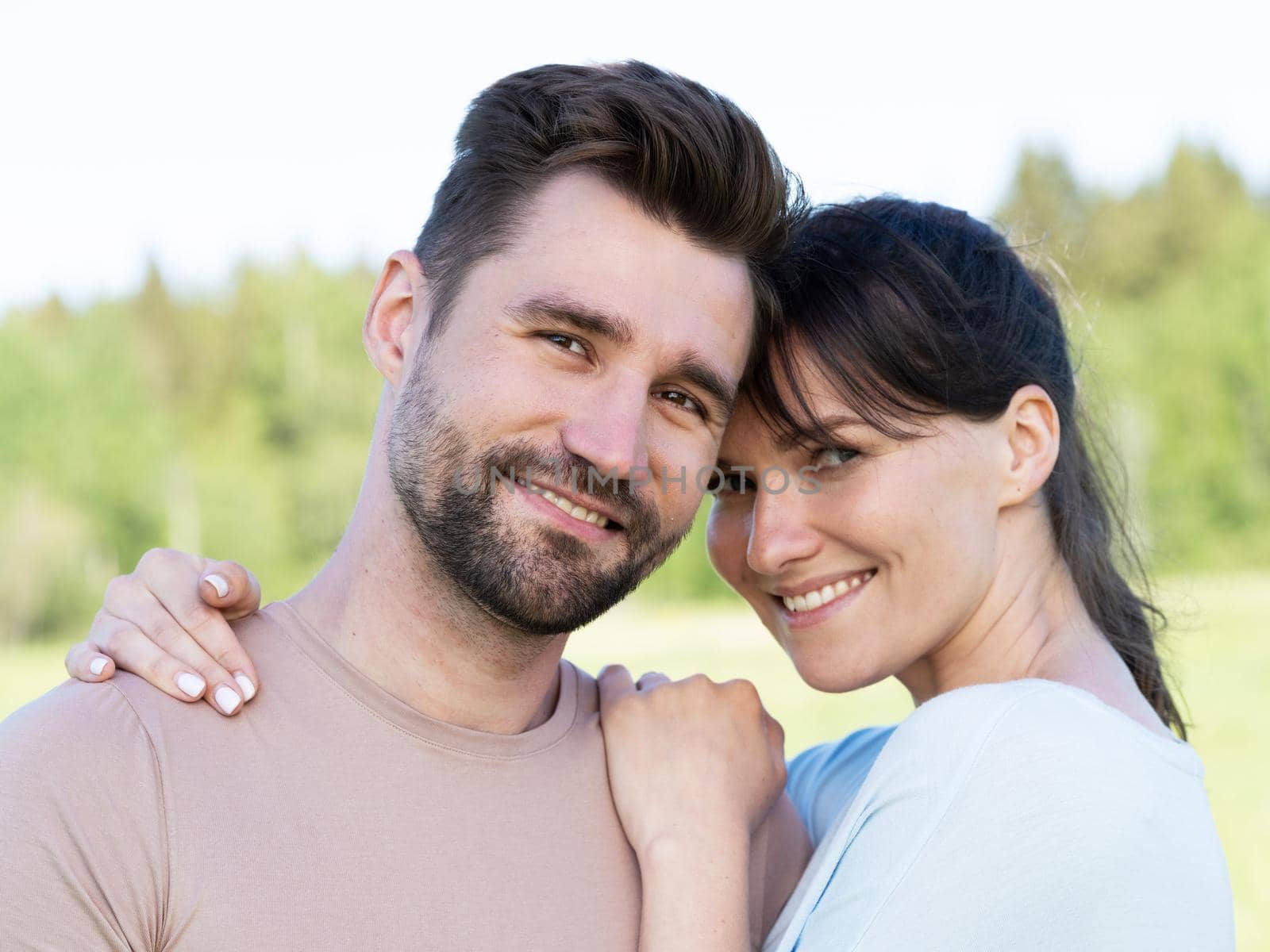 Portrait of a smiling mid adult couple in summer park