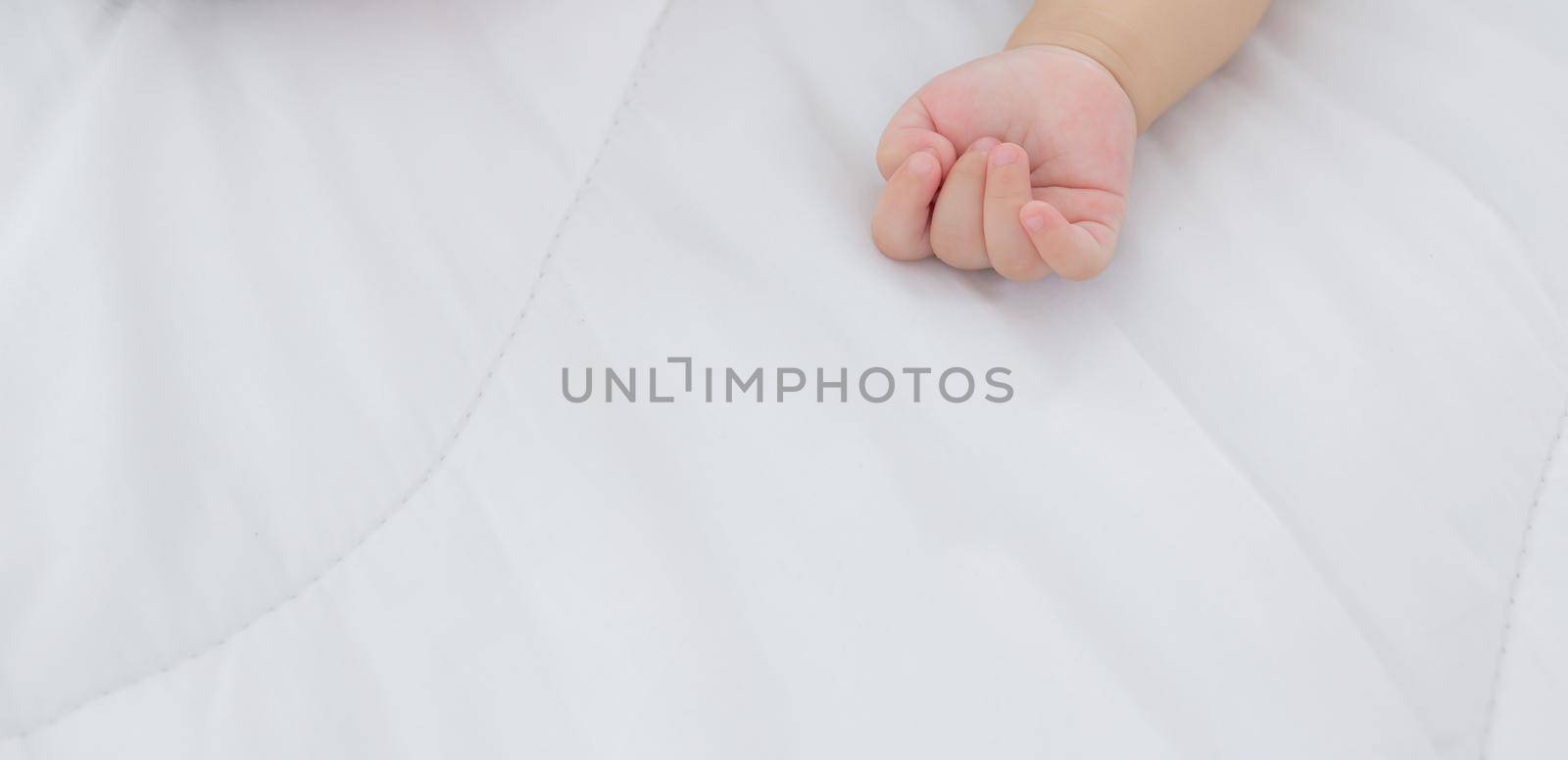 Portrait of asian little baby girl sleeping on bed in the bedroom at home, newborn napping with cozy and relax, infant innocence in bedtime, happy toddler cute, growth of child and emotion, indoors.