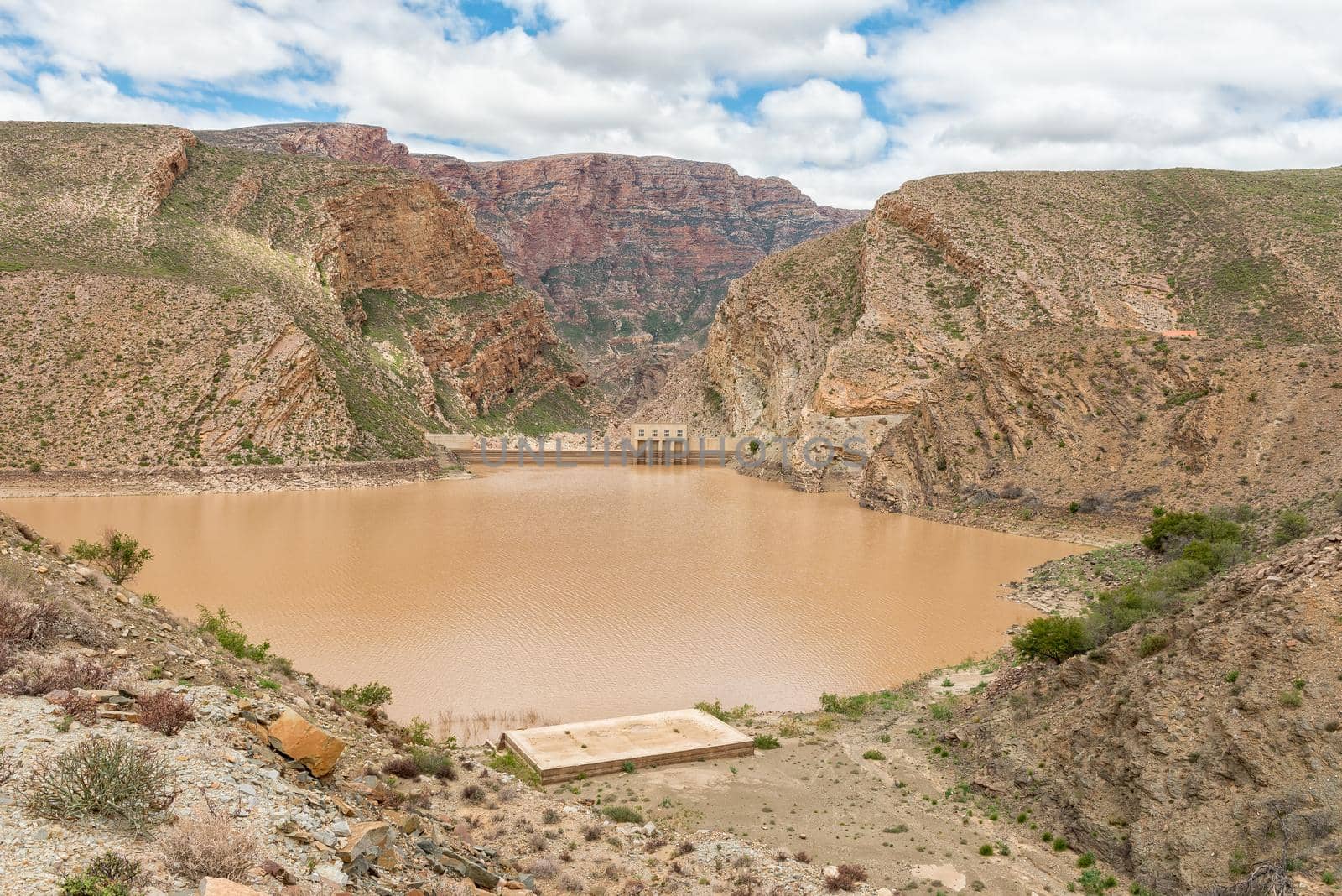 View of the Gamkapoort Dam in the Swartberg mountains. The dam wall is visible