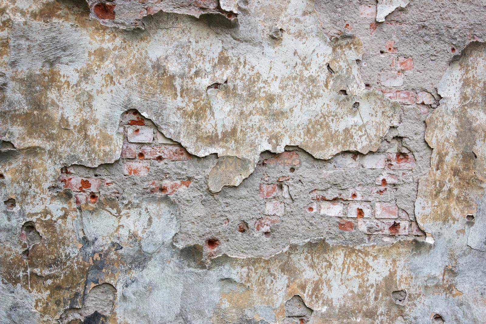 old brick wall with crumbling plaster outdoor by raddnatt