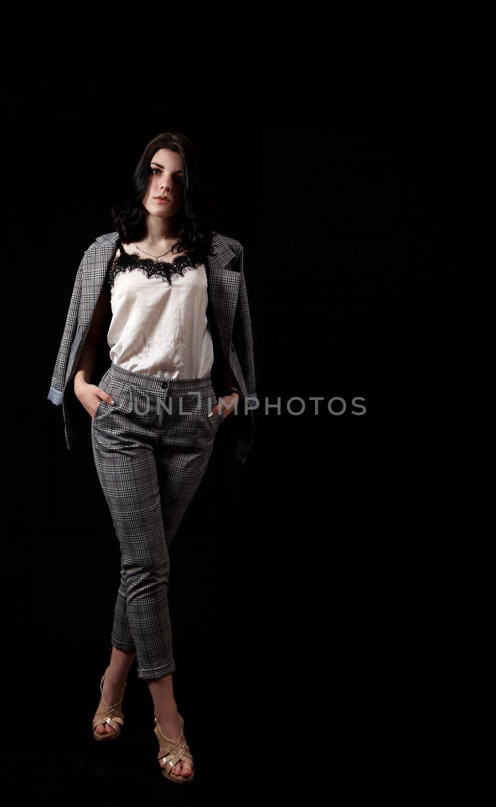 young beautiful girl posing standing in the studio by raddnatt