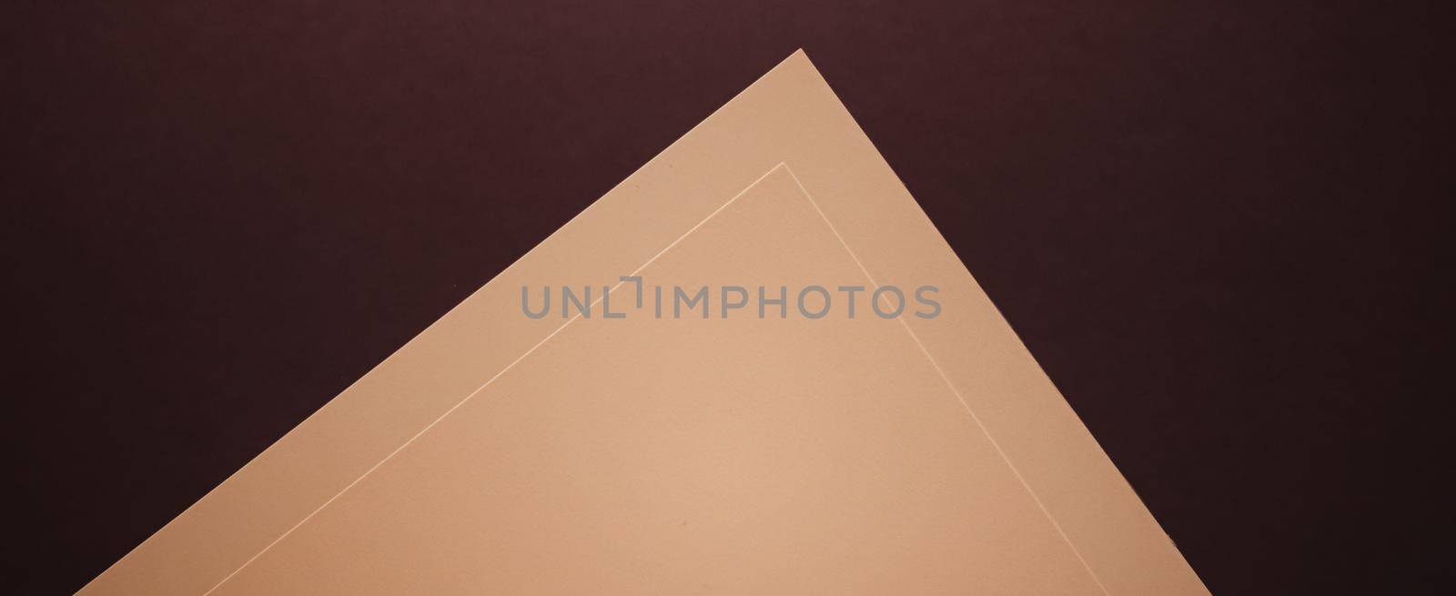 Blank A4 paper, beige on dark background as office stationery flatlay, luxury branding flat lay and brand identity design for mockups