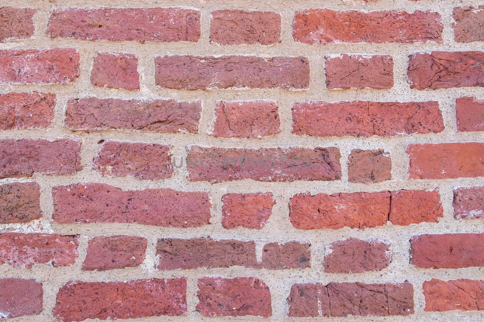 Close-up of an old red brick wall. by OlgaGubskaya