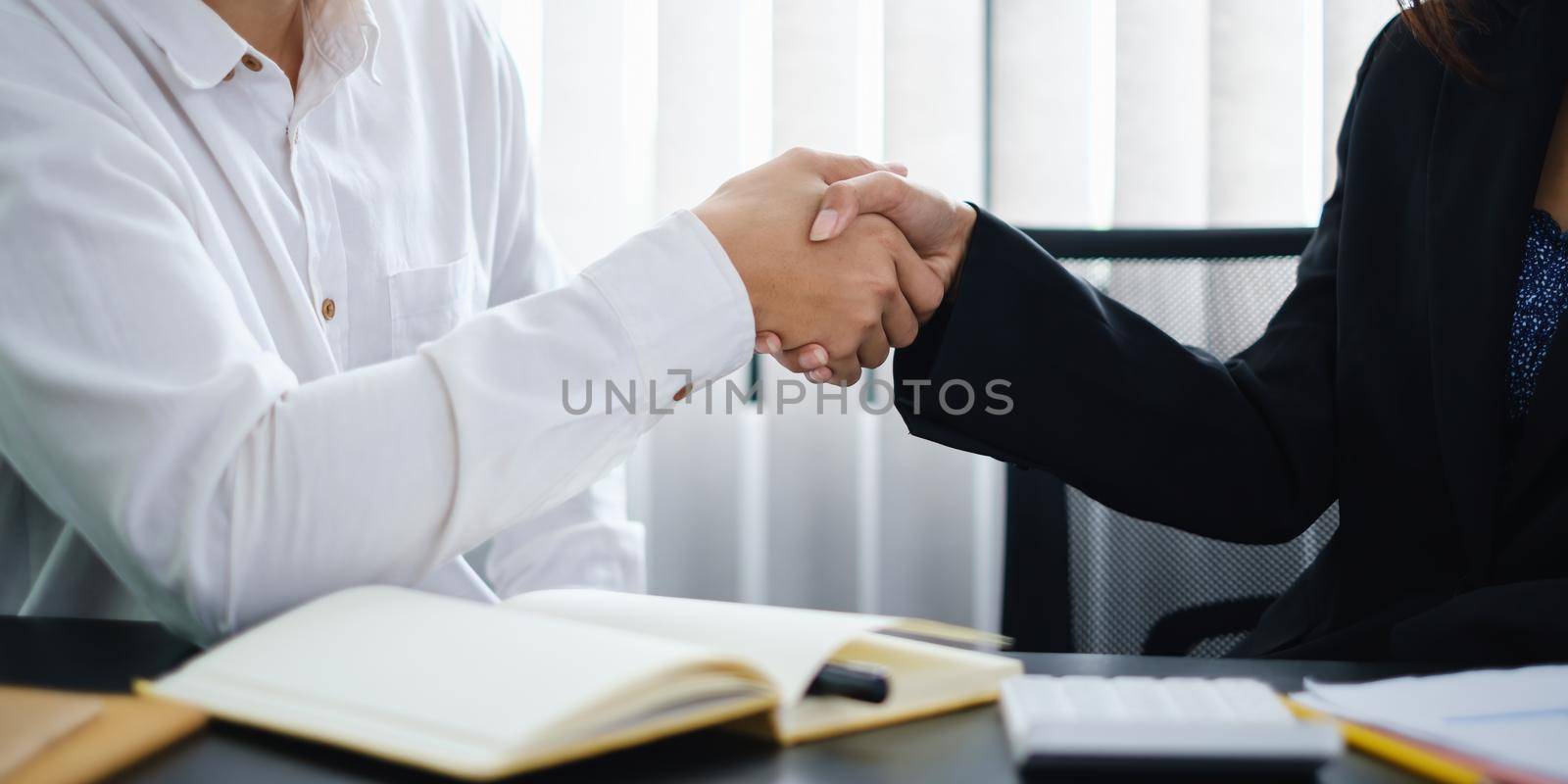 Business partnership meeting concept. Image businessmans handshake. Successful businessmen handshaking after good deal. Group support concept by itchaznong