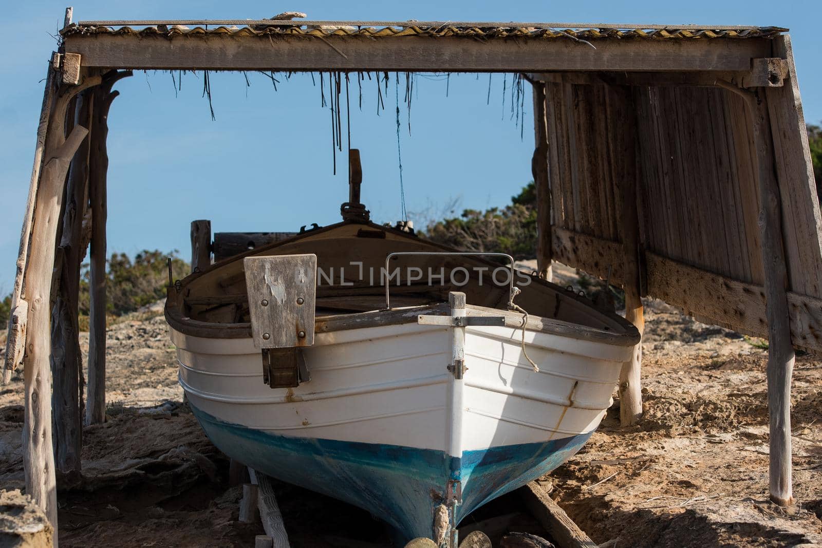 Fisherman's boat on the beach of Illetes in Formentera, Spain.