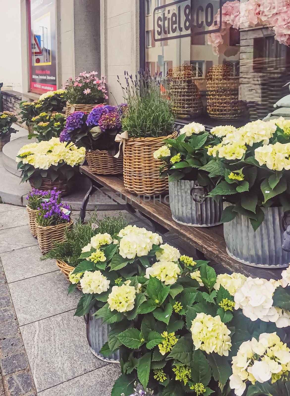 Flower shop on street of Wollerau, canton of Schwyz in Switzerland, Swiss architecture and real estate by Anneleven