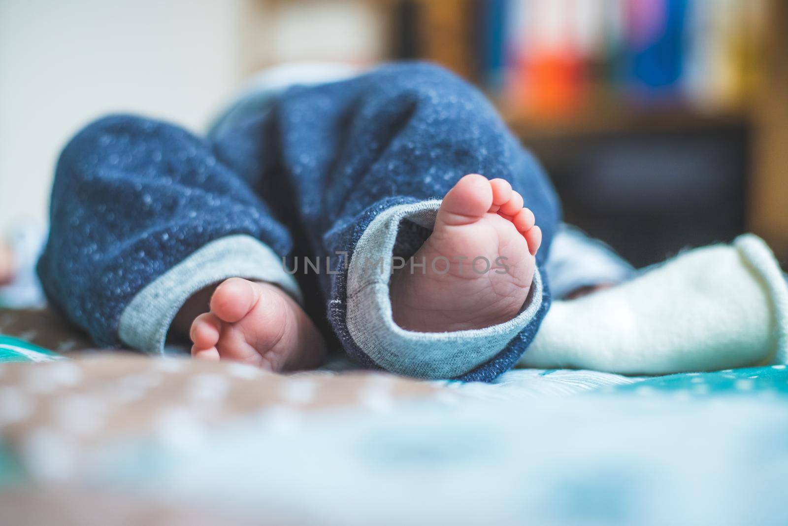 Baby and newborn concept: Close up of newborn baby feet on baby blanket by Daxenbichler