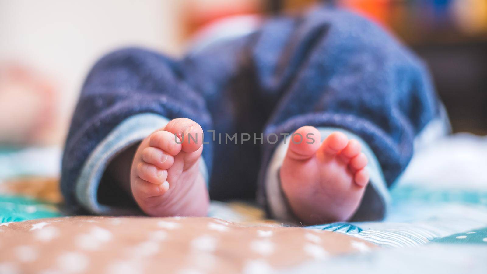 Baby and newborn concept: Close up of newborn baby feet on baby blanket by Daxenbichler